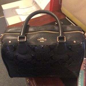 Black used coach purse in fair condition
